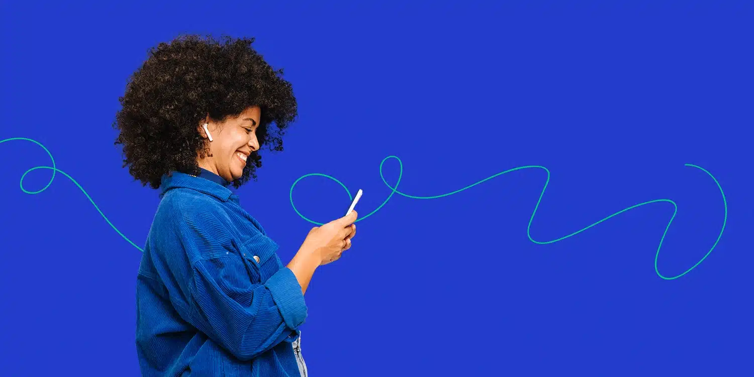 Woman smiling and looking at phone
